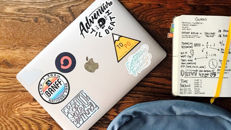 Apple MacBook with stickers